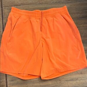LULULEMON Bright Orange Men’s Pace Breaker Linerless Shorts 7”. Sz M.